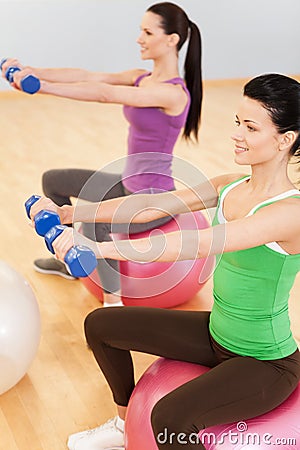 Pilates aerobics women group with stability ball.