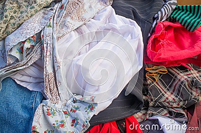 Pile of second hand clothes background