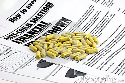 Pills upon article about financial crisis isolated