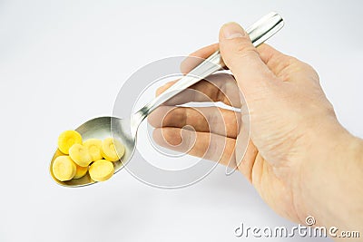 Pills on spoon