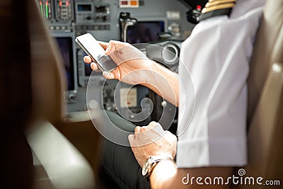 Pilot Using Cell Phone In Cockpit