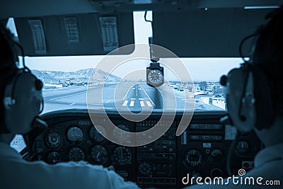 Pilots in the small plane cockpit landing