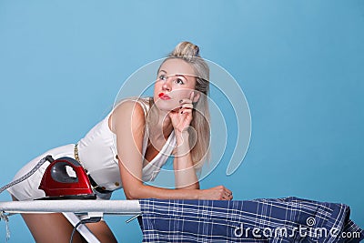 Pin up girl retro style portrait woman ironing