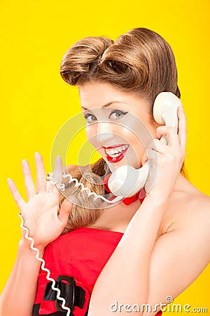 Pin-up girl talking on retro telephone