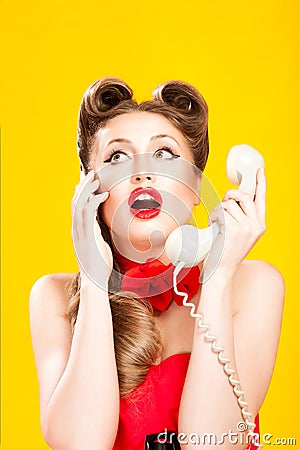 Pin-up girl talking on retro telephone