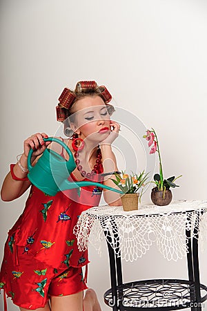 Pin up girl watering the flowers