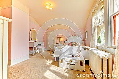 Pink bedroom with white bed and nightstand