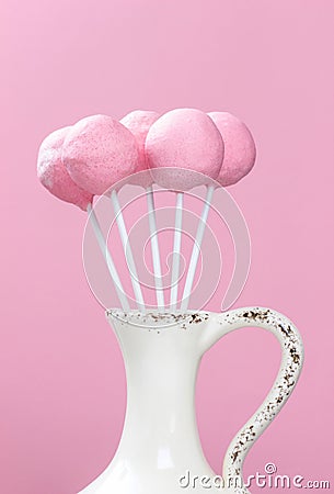 Pink cake pops in ceramic vase