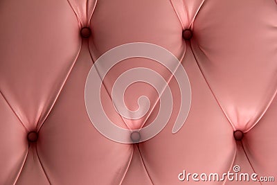 Pink leather background with big,bold buttons