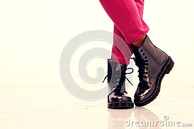 Pink pants and shiny leather boots