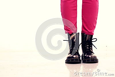Pink pants and shiny leather boots