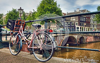Pink Parked Bicycle Beside a Canal in Amsterdam