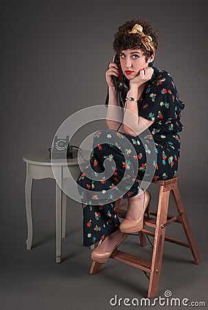 Pinup Girl in Flowered Outfit Ultra Bored on the Telephone