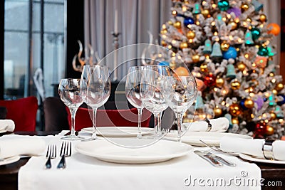 Place setting with Christmas tree in background