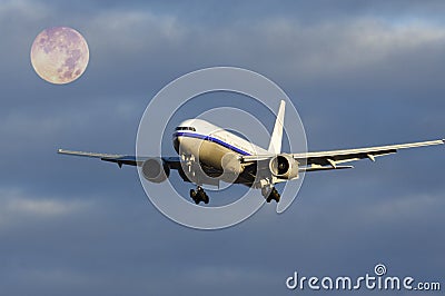 Plane flying with moon