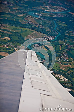 Plane turning over french country side and river