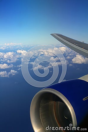 Plane Wing with sky and ocean background