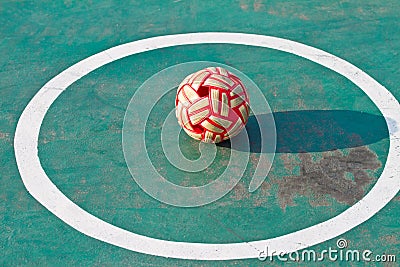 Plastic Sepak takraw ball on the cement floor.