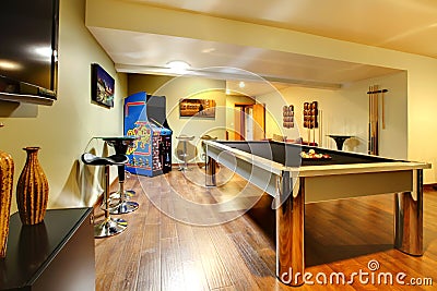 Play party room home interior with pool table.