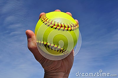 Player Gripping a Yellow Softball