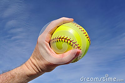 Player Gripping a Yellow Softball