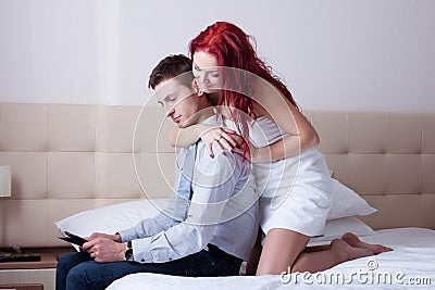 Playful attractive woman flirting with young man