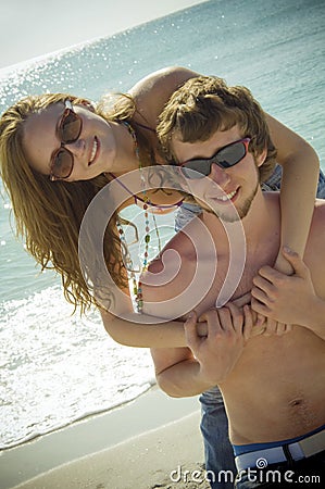 Playful young beach couple