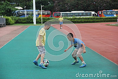 The playing football of boys in shenzhen shekou sports center