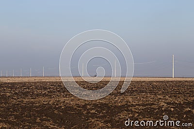 Plowing Soil, Electricity Poles