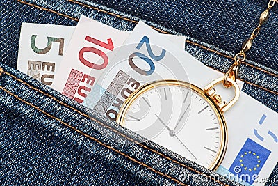 Pocket watch with chain in jeans and money euro.