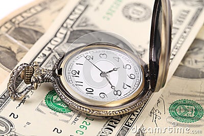 Pocket watch on money.