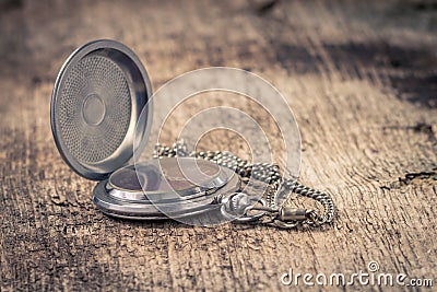 Pocket watch at old wood background