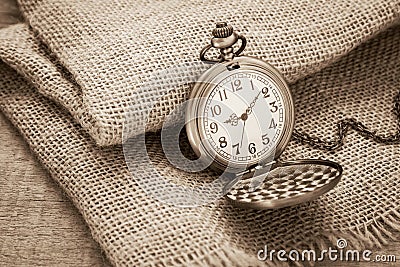 Pocket watch on sackcloth, vintage style