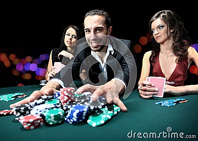 Poker player going all in pushing his chips