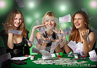 Poker players in casino with cards and chipsv