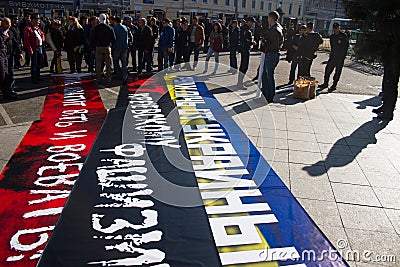 Police chief Viktor Biryukov checks posters opposition peace March