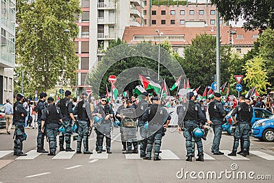 Police follows people protesting against Gaza strip bombing in Milan, Italy