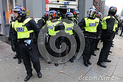 Police Guard a Vandalised Bank at a Riot in London