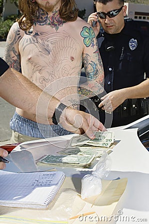 Police Officer Arresting Drug Dealer