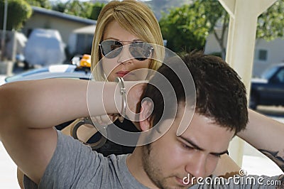 Police Officer Arresting Young Man