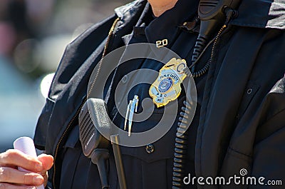 Police officer with badge and uniform