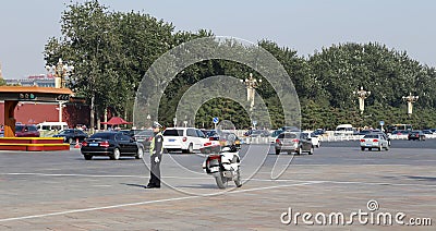 Police officer with bike on the road in central Beijing