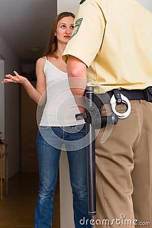 Police officer interrogation woman at front door