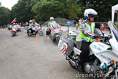 Police riding motorcycle