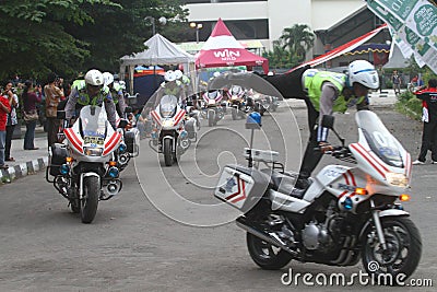 Police riding motorcycle