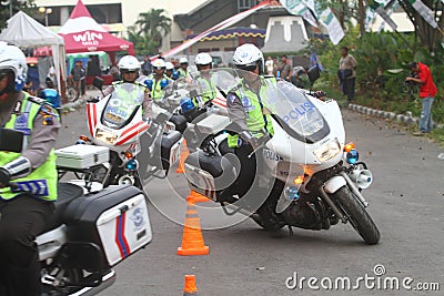 Police riding motorcycle