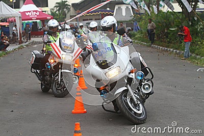 Police riding motorcycle