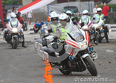 Police riding motorcycle