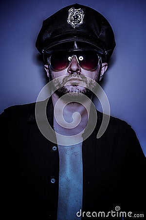 Police sexy, naked man with cap and glasses
