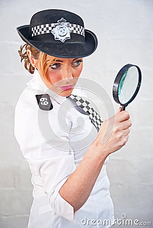 Police Woman 69 with magnifying glass